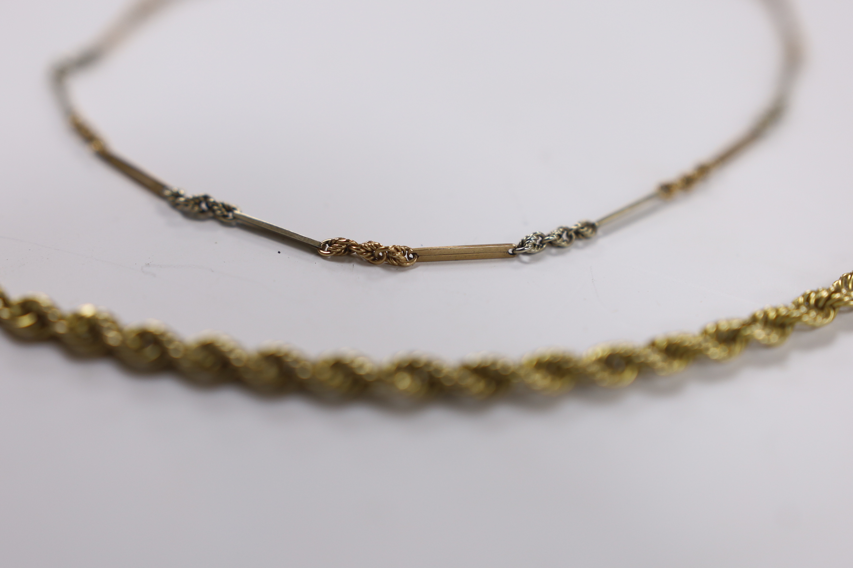 A 9ct gold rope twist chain, 50cm, together with a small 9ct albertina